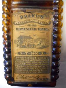 Front Label of 6 Log Drake's Plantation Bitters and Old Homestead Tonic, New York