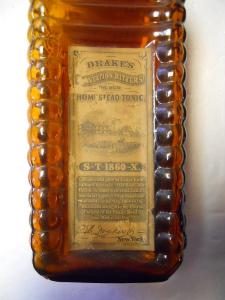 Front Label of 4 Log Drake's Plantation Bitters and Old Homestead Tonic, New York